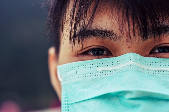 a woman wearing a facemask during corona virus pandemic