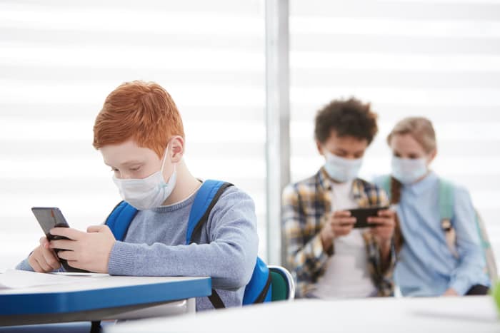 children wearing masks in spain