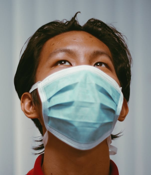young man wearing facemask