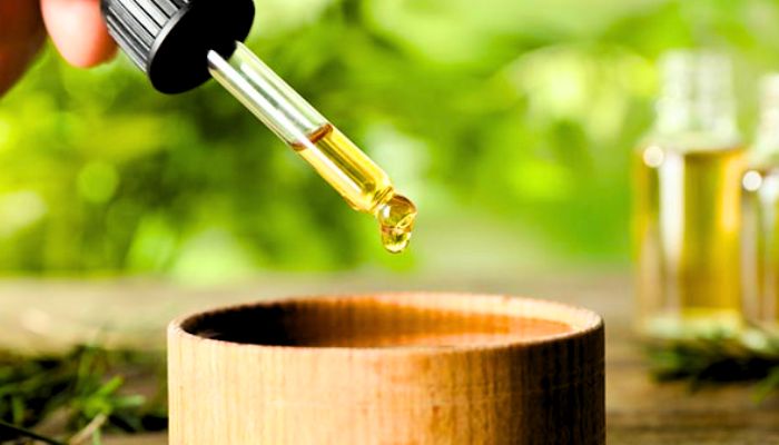 oil-droplet-into-a-wooden-bowl